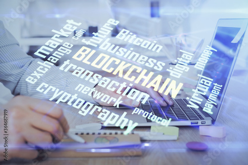 Blockchain theme hud with man working on computer on background. Concept of crypto chain. Double exposure.