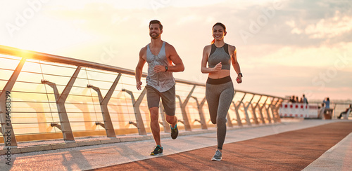 Fototapeta Naklejka Na Ścianę i Meble -  Couple doing sport on the street