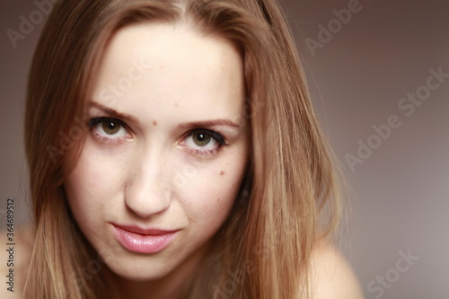 Emotional girl portrait on the brown background