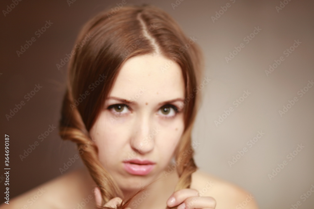 Emotional girl portrait on the brown background