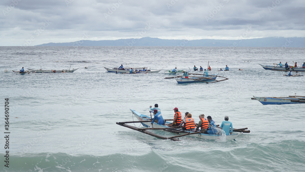 Obraz premium Tourists going into the water to swim with Whale sharks at Oslob beach on Donsol island near Cebu City, Philippines.