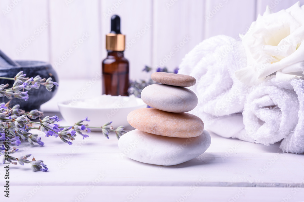 Spa massage set with lavender oil on wooden background Spa massage set with lavender oil on wooden background