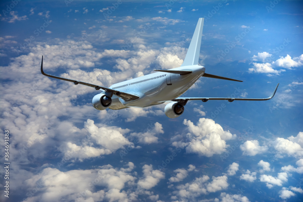 Obraz premium Passenger airplane in the clouds.