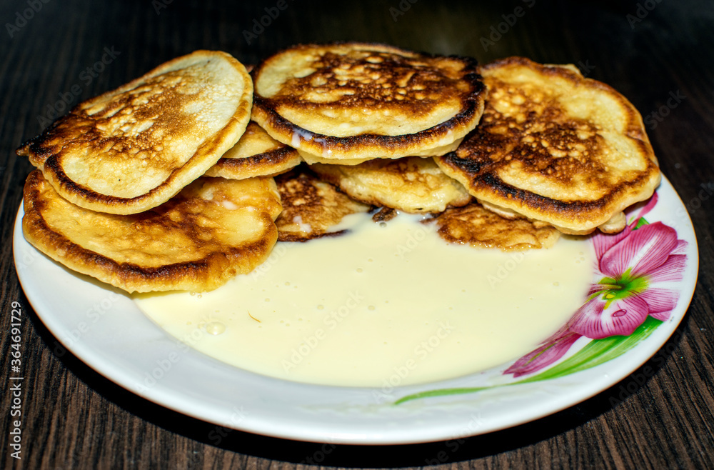 pancakes with condensed milk on a plate