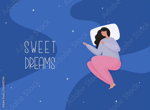 Young woman in pajamas sleeping on soft pillow. Sweet dreams, good health concept.