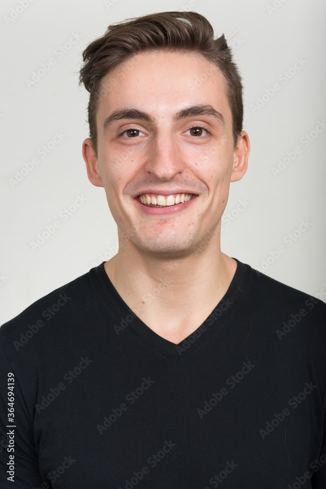 Face of happy young handsome man smiling Face of happy young handsome man smiling