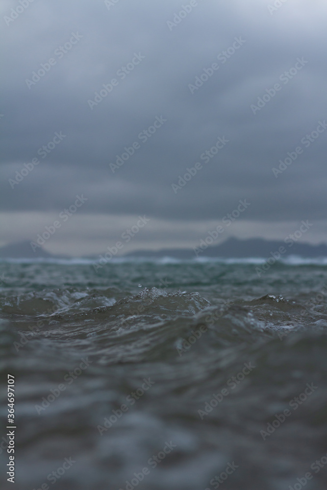 Small waves breaking off the coast of New Zealand. Small waves breaking off the coast of New Zealand.