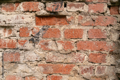 Texture of an old red brick wall, background