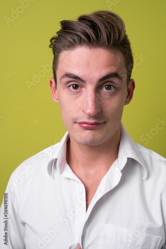 Face of young handsome businessman looking at camera