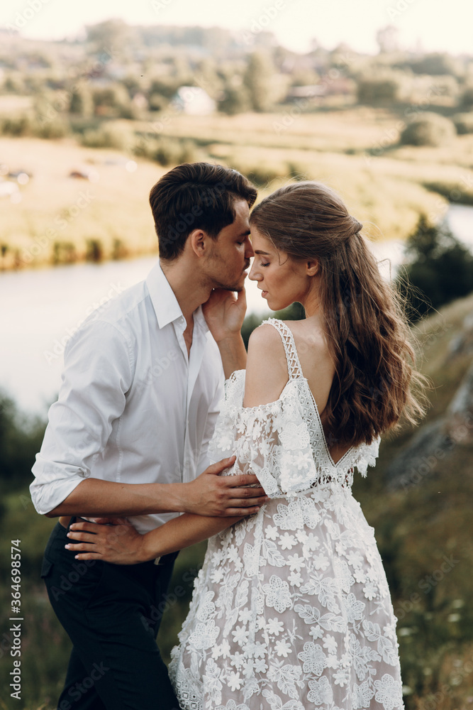 Beautiful couple in nature in boho style. Wedding in European style fine art at sunset. Beautiful couple in nature in boho style. Wedding in European style fine art at sunset.