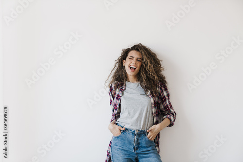 Photo of happy beautiful woman smiling while posing on camera