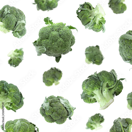 Set of fresh green broccoli falling on white background