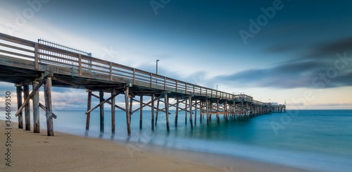 Obraz na plátne Long exposure shot of a pier on the beach in California