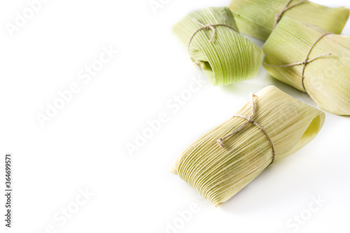 Mexican corn and chicken tamales isolated on white background. Copy space