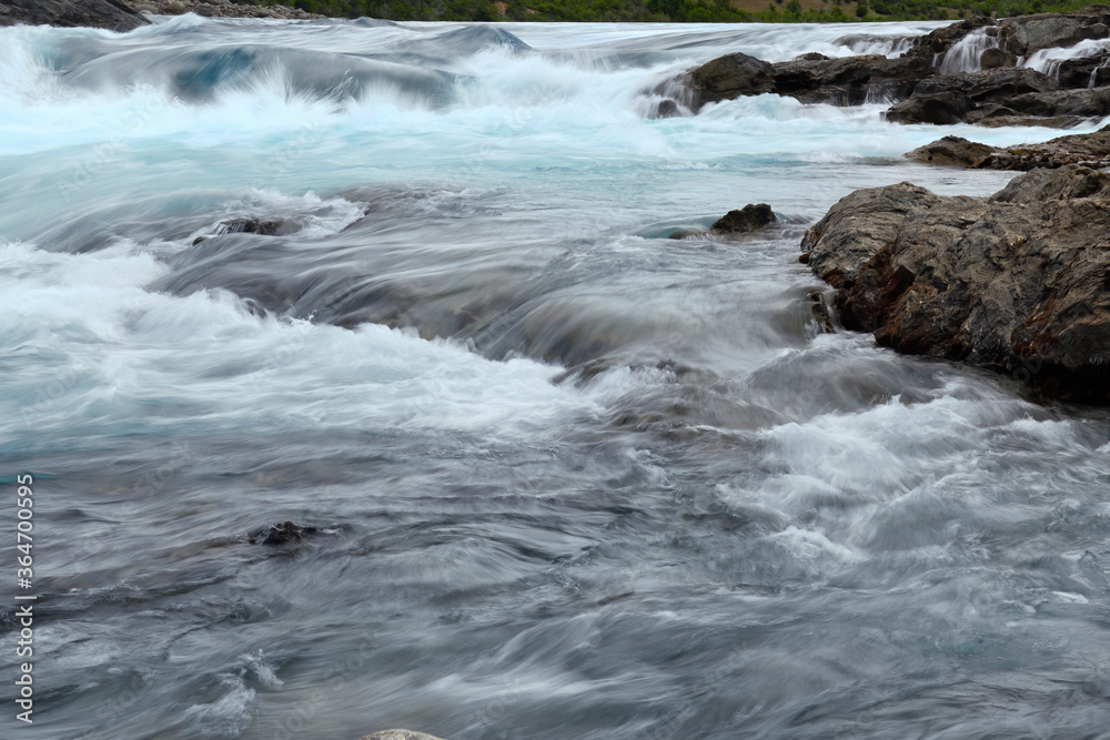 Rapids at the confluence of blue Baker river and grey Neff river, Pan-American Highway between Cochrane and Puerto Guadal, Aysen Region, Patagonia, Chile