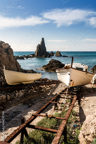Barcas de pesca en el en viejo embarcadero de la Cala de Las Sirenas en el Parque Natural de Cabo de Gata-Níjar, provincia de Almeria, Andalucía, España photo