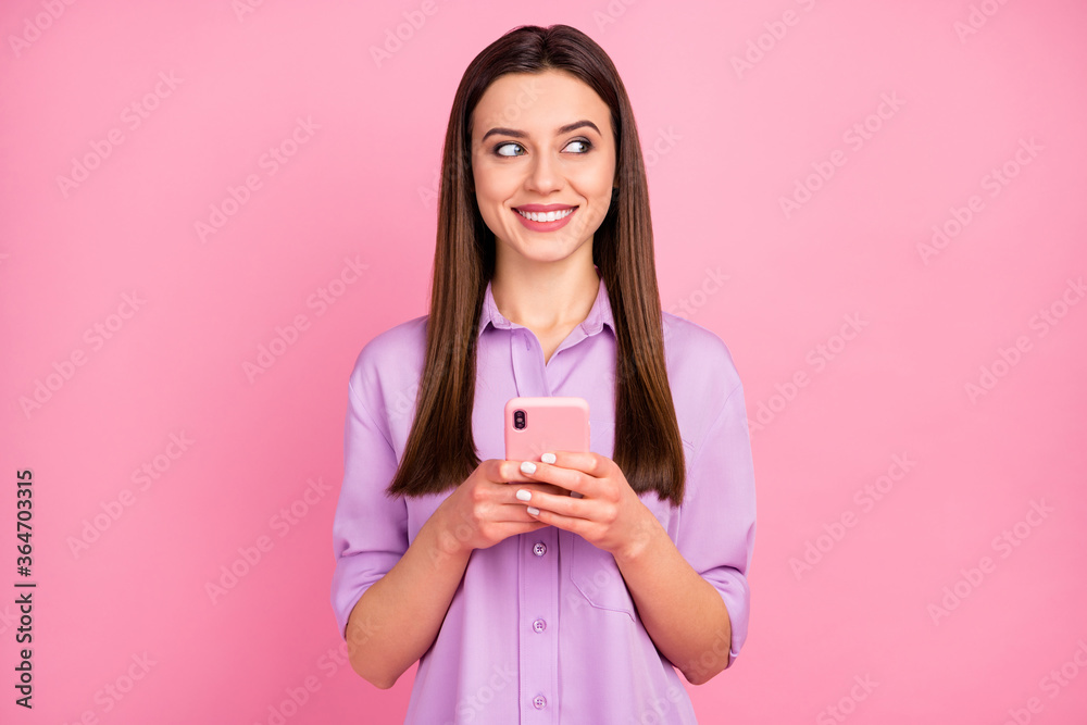 Portrait of her she nice attractive lovely pretty charming cute cheerful cheery long-haired girl using cell creating media smm isolated over pink pastel color background Portrait of her she nice attractive lovely pretty charming cute cheerful cheery long-haired girl using cell creating media smm isolated over pink pastel color background
