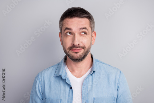 Close-up portrait of his he nice attractive creative dreamy doubtful cheery guy worker executive manager overthinking solution isolated over gray light pastel color background