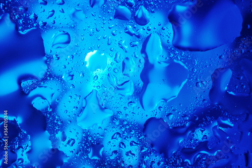 Water drops on a blue abstract background