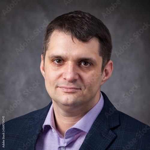 a young man businessman on a plain background.