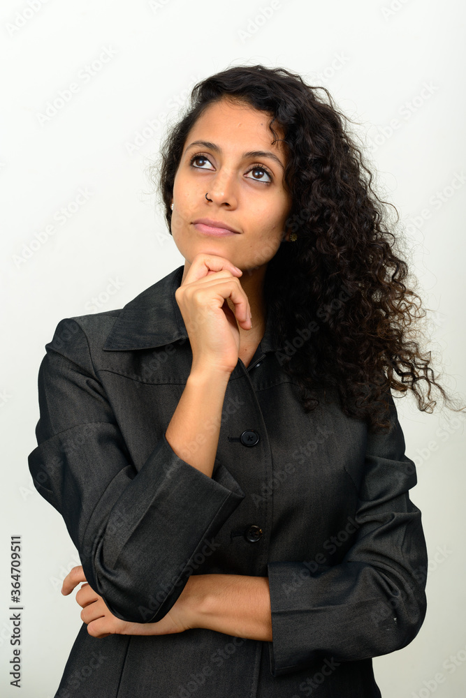 Portrait of young beautiful Hispanic businesswoman with curly hair Portrait of young beautiful Hispanic businesswoman with curly hair