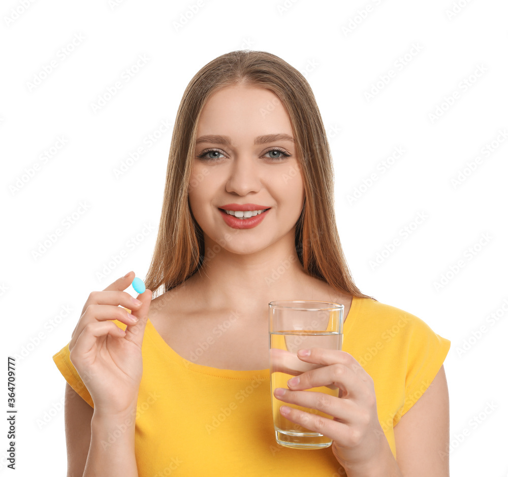 Young woman with vitamin pill and glass of water on white background Young woman with vitamin pill and glass of water on white background