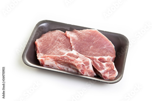 Raw pork steak in a package isolated on white background