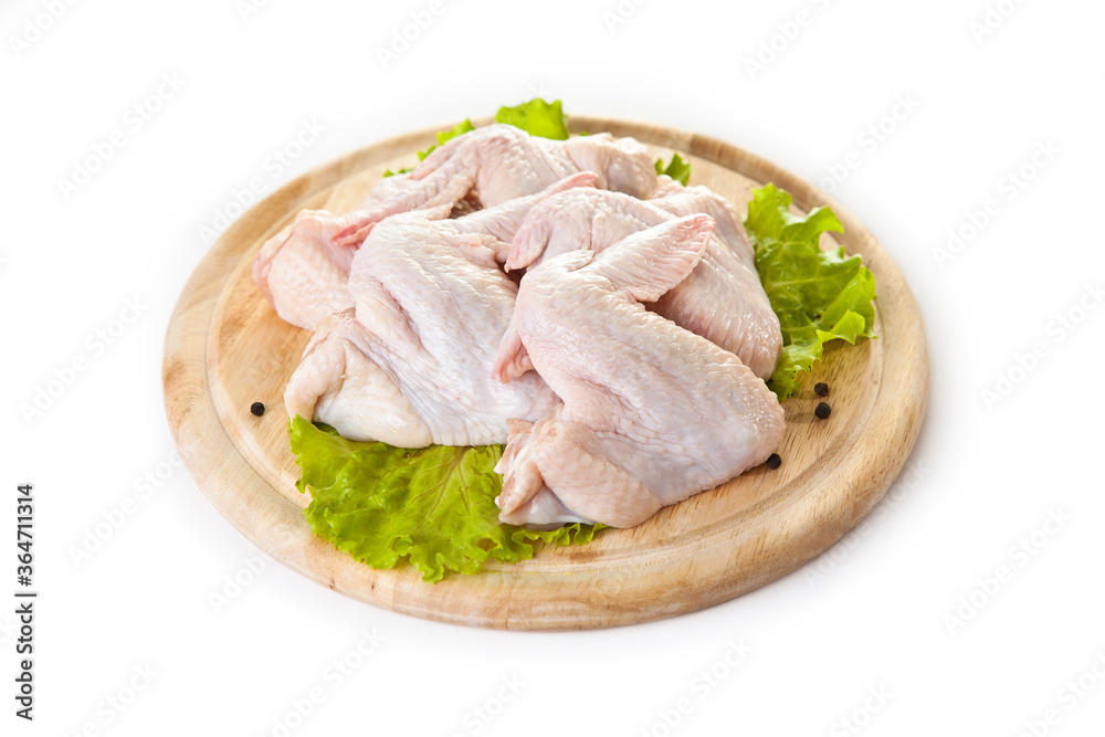 raw chicken wings on the cutting board isolated on the white raw chicken wings on the cutting board isolated on the white
