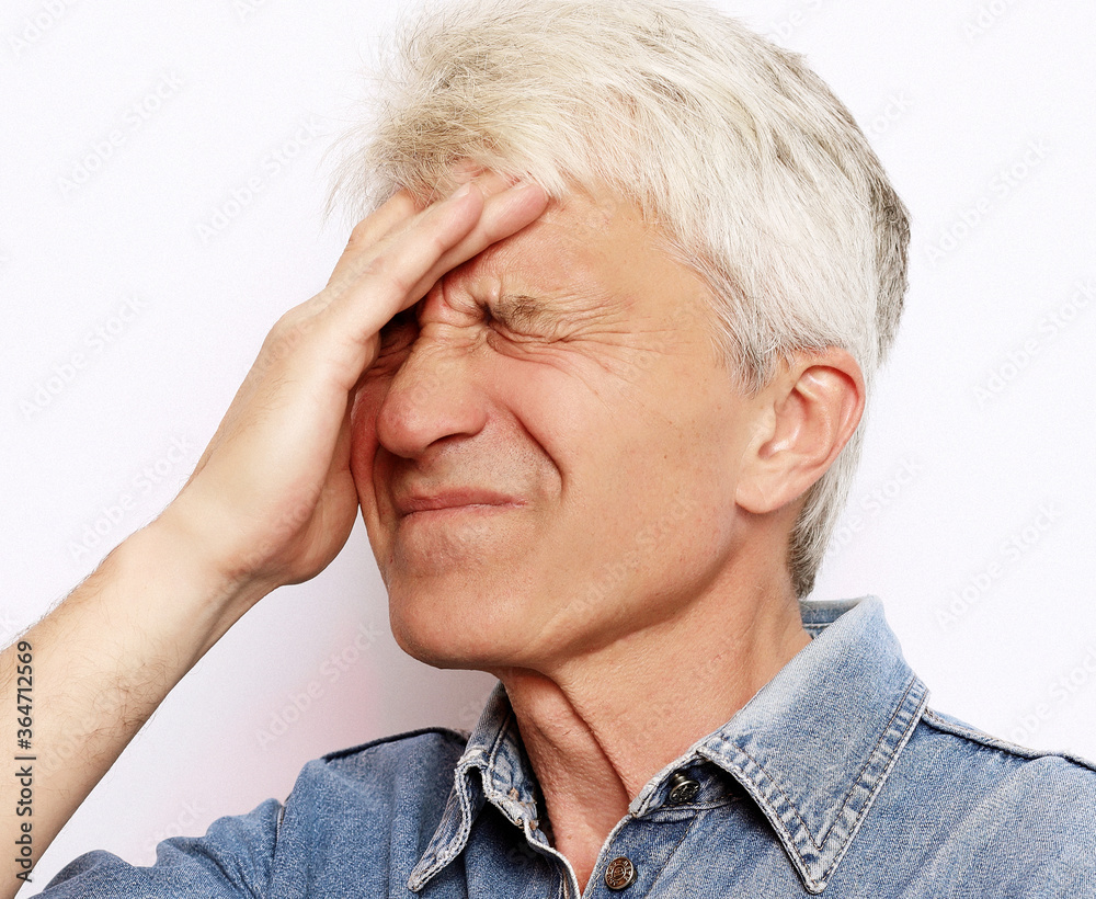 lifestyle, health and people concept: Senior man has headache lifestyle, health and people concept: Senior man has headache