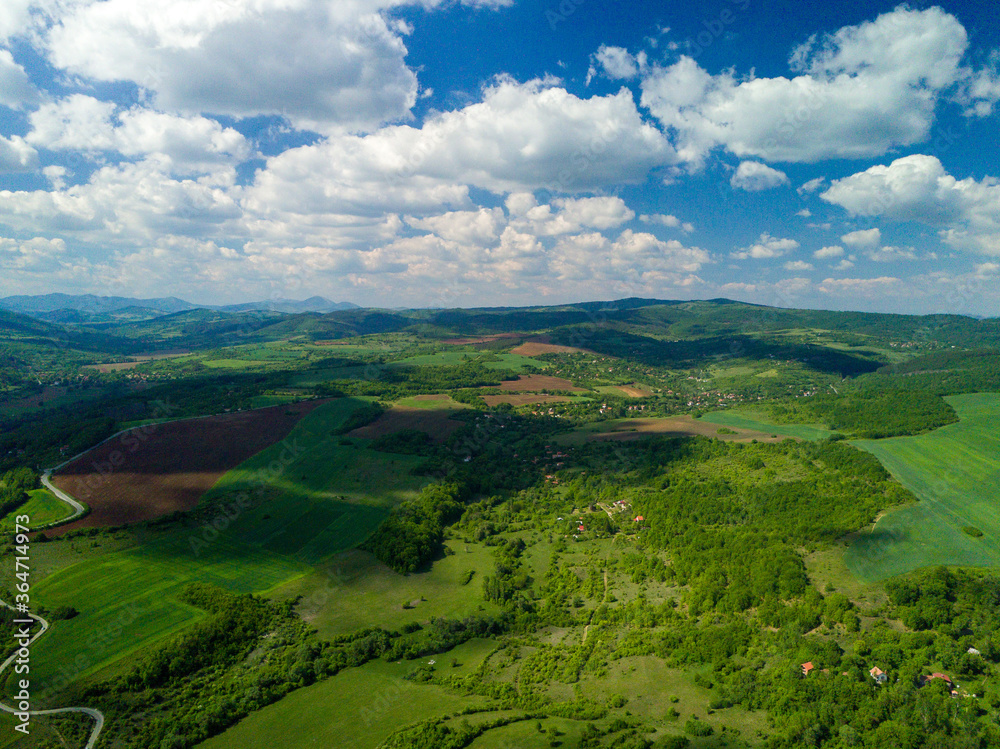 landscape with hills and blue sky from drone