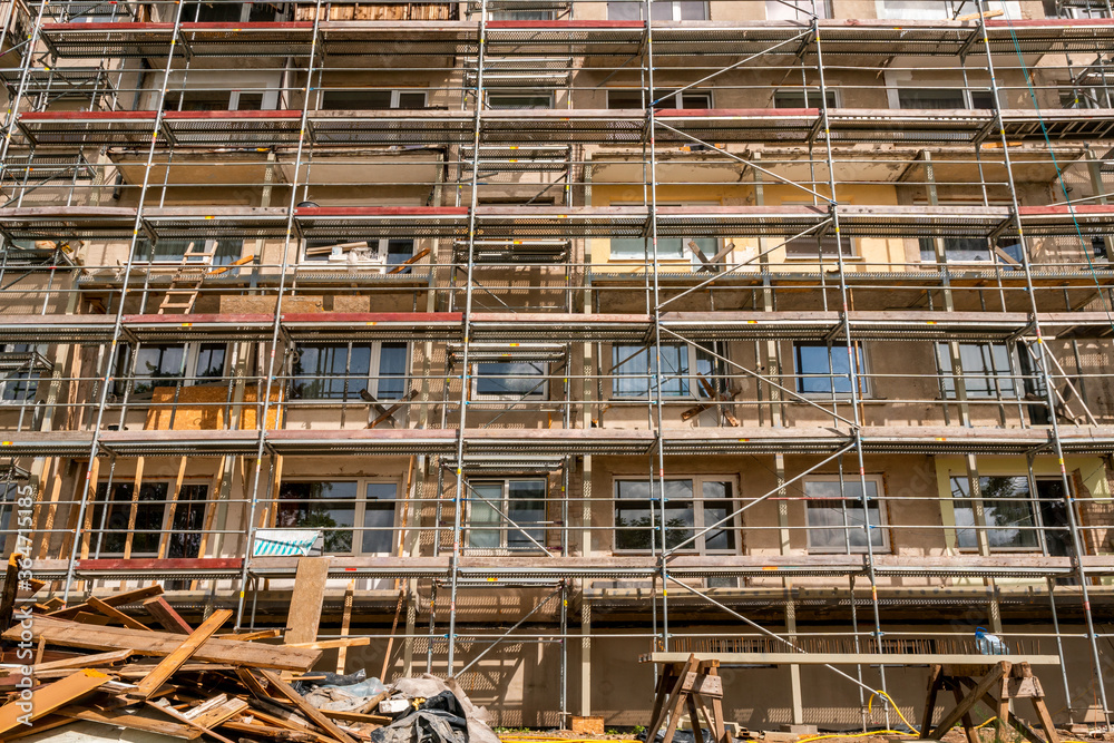 Tall building under construction with scaffolds Tall building under construction with scaffolds