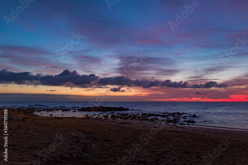 Scenic colorful sunset at the sea coast. Good for wallpaper or background image Radiant sea beach sunset Panoramic photo .Sunset sea horizon sky clouds. Sea sand beach 