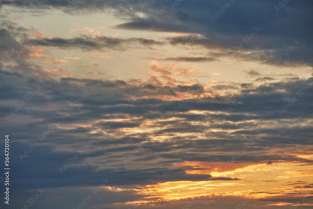 Fototapeta premium Cloudy sunset on a summer evening