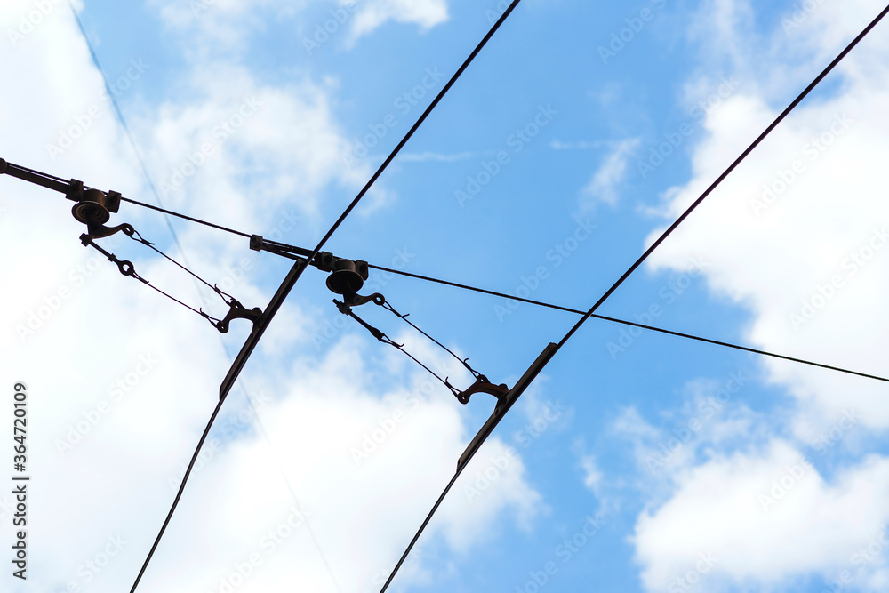 Wires for the trolley against the sky backgound. Wires for the trolley against the sky backgound.