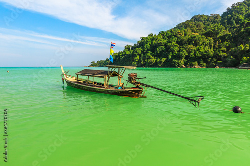 Tropical waters of Surin Islands, Andaman Sea, Phang Nga. Fisherman village in Ko Surin NP. Traditional Thai long-tail boat at Moken tribe Village of Sea Gypsies in Thailand.
