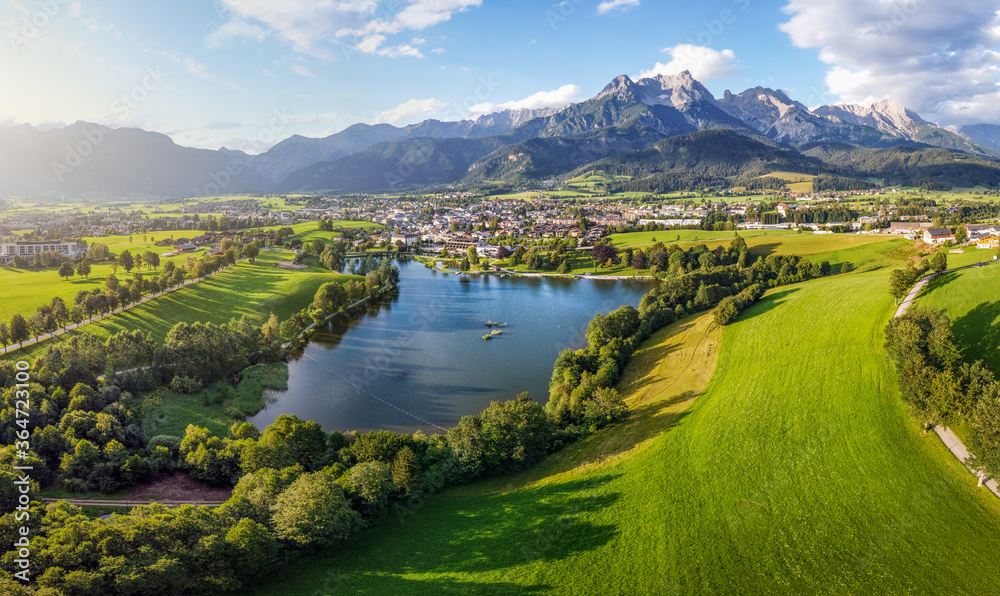 Fototapeta premium Aerial view over Saalfelden with Steinernes Meer in Summer, Salzburg, Austria