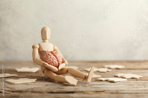 Slika na platnu Toy man sits depressed with a puzzle