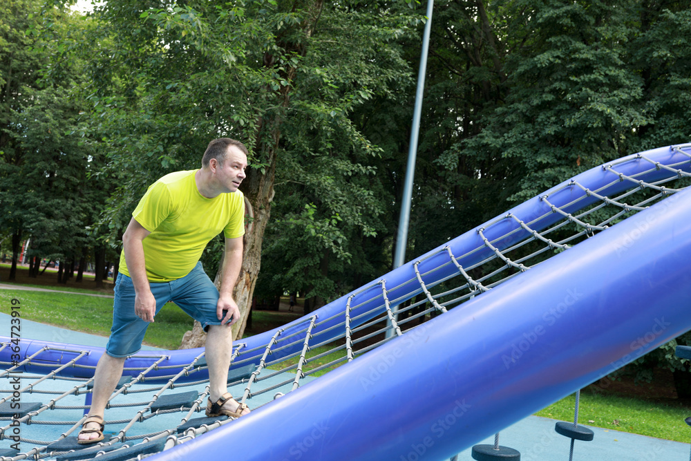 Fototapeta premium Man training over obstacle course