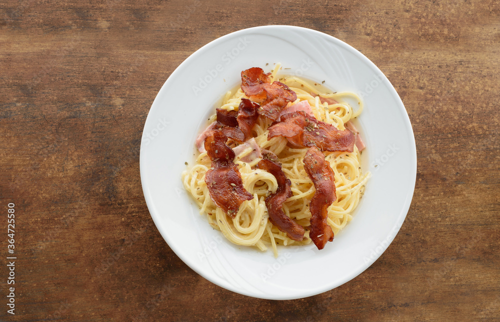Carbonara pasta Spaghetti bacon noodle on wood top view Carbonara pasta Spaghetti bacon noodle on wood top view