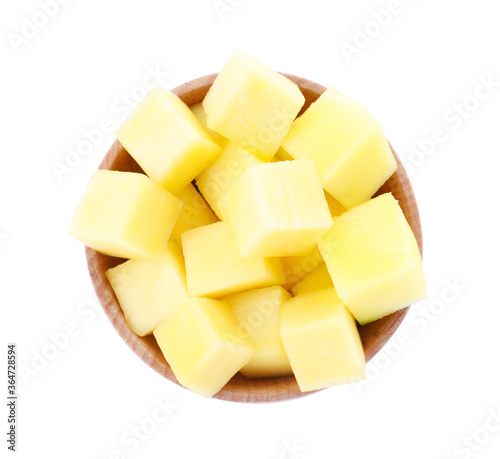 Tasty mango cubes in wooden bowl isolated on white, top view