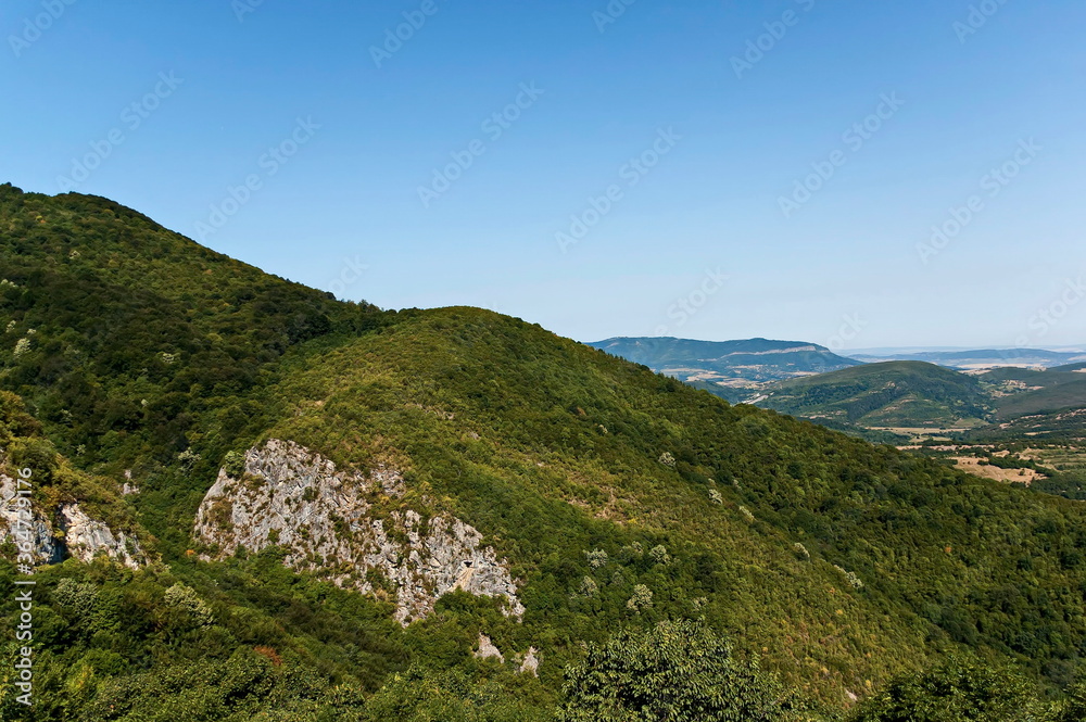Panorama with hills and an old green forest in the Balkan Mountains near the town Teteven , Bulgaria  