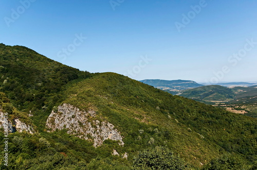 Panorama with hills and an old green forest in the Balkan Mountains near the town Teteven , Bulgaria 