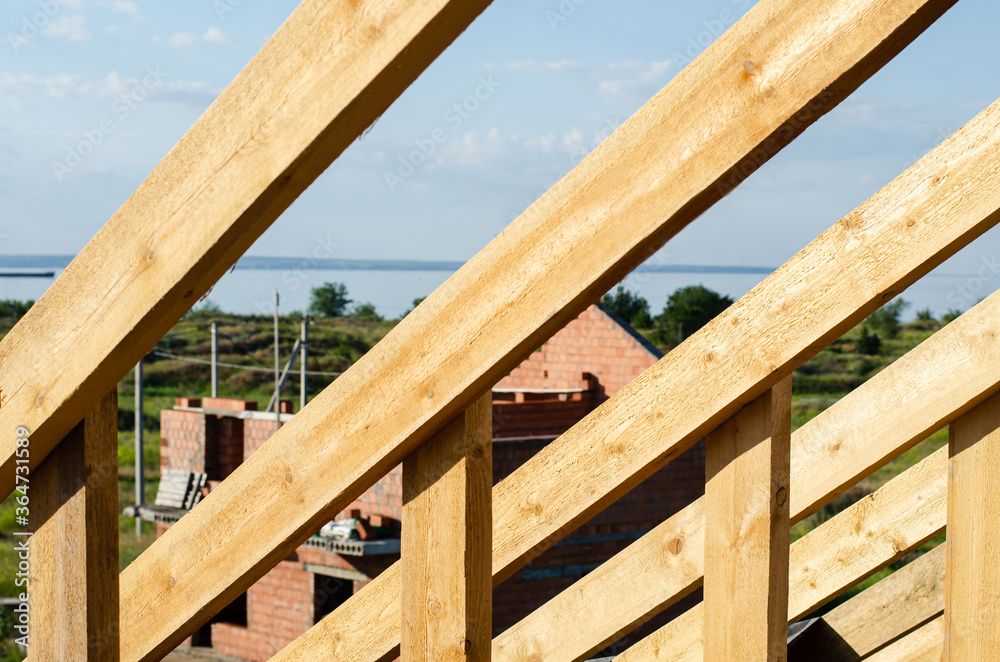 wooden frame of beams for the roof of the house. construction of houses wooden frame of beams for the roof of the house. construction of houses