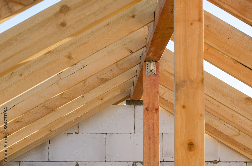 wooden frame of beams for the roof of the house. construction of houses wooden frame of beams for the roof of the house. construction of houses