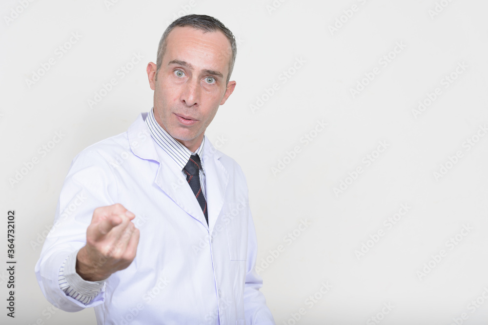 Portrait of mature handsome man doctor with gray hair Portrait of mature handsome man doctor with gray hair
