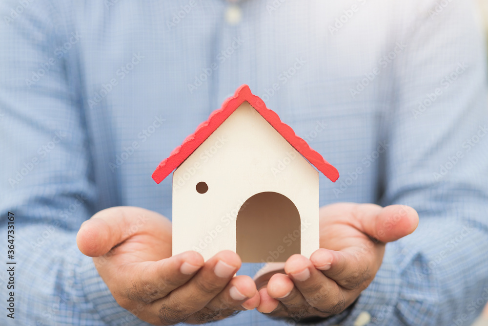 Hand holding mockup house. Real estate loan insurance buy and sell home concept. Hand holding mockup house. Real estate loan insurance buy and sell home concept.