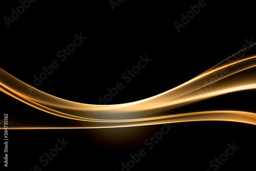 Gold wave of smoke on black background