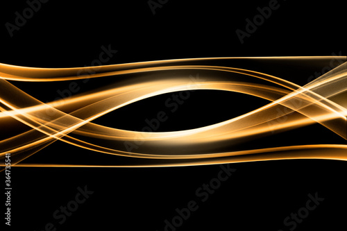 Gold wave of smoke on black background 