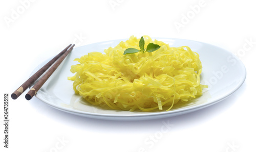 yellow noodles on dish isolated on white background