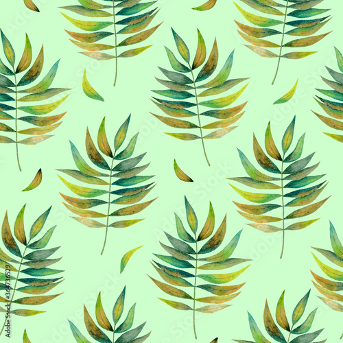 Seamless pattern with leaves on green background 